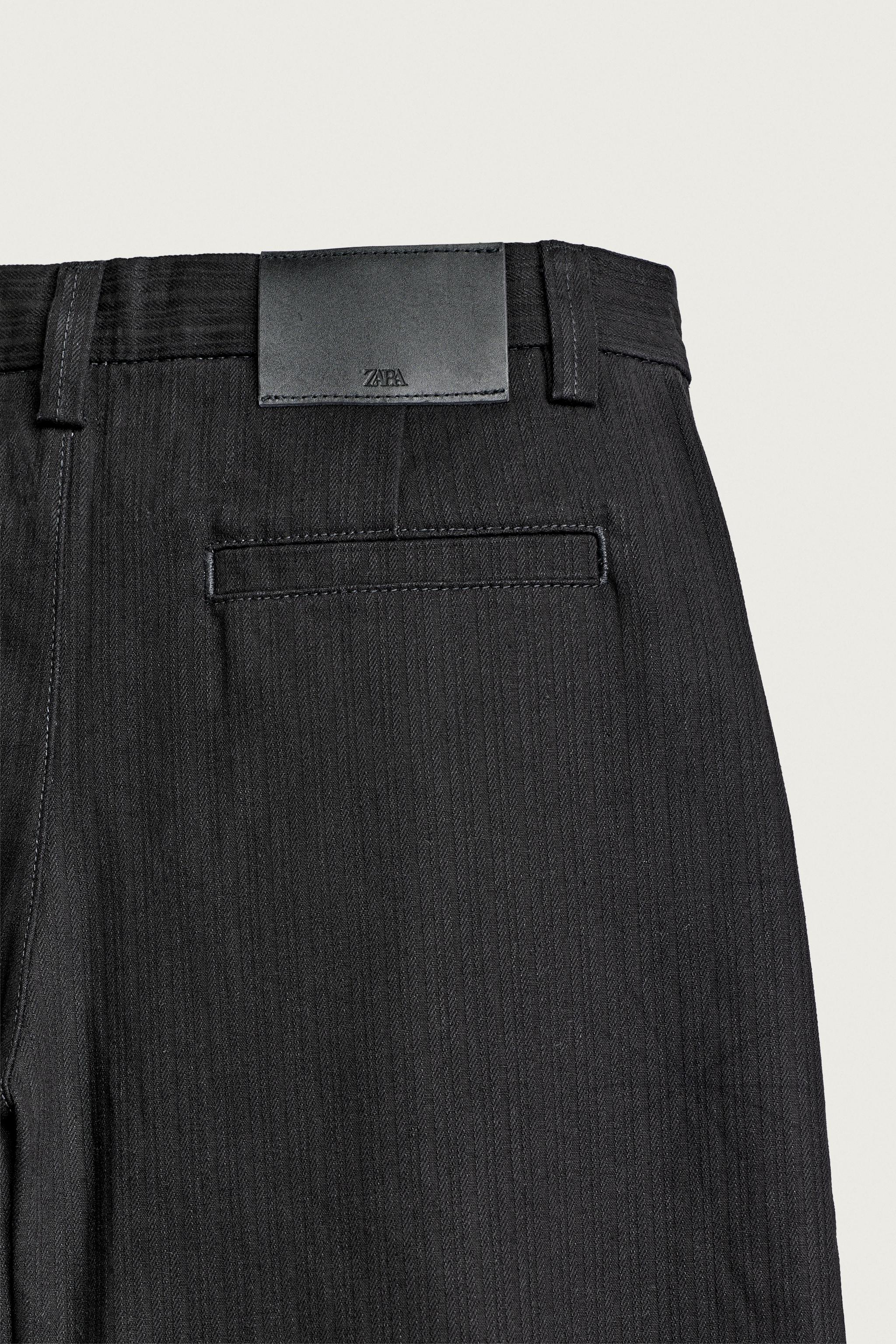 RELAXED FIT PLEATED CHINO PANTS